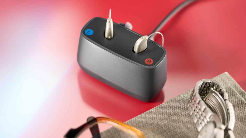ReSound Savi hearing aids with charger.