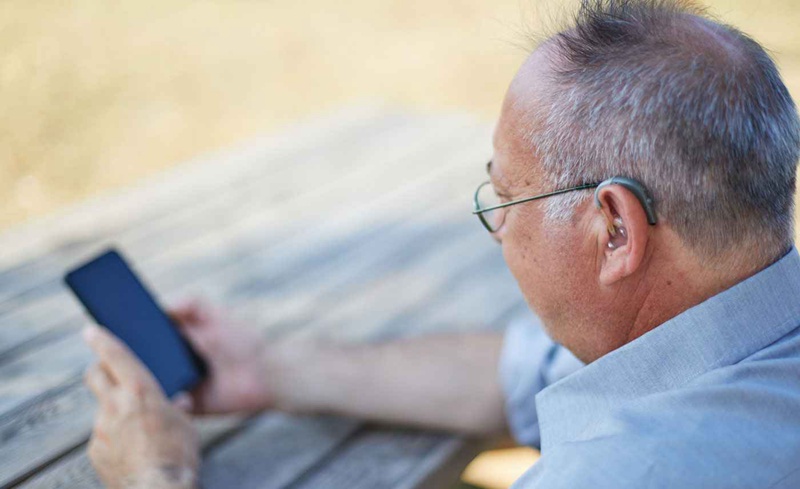 Accessing a hearing loop with a telecoil-equipped hearing aid is as simple as changing listening programs through a hearing aid smartphone app or sometimes by simply pressing a button on your hearing aid.
