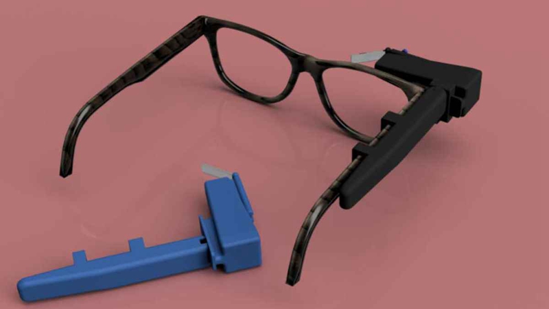 Photo of Transcribe glass that snaps onto side of glasses for live captioning