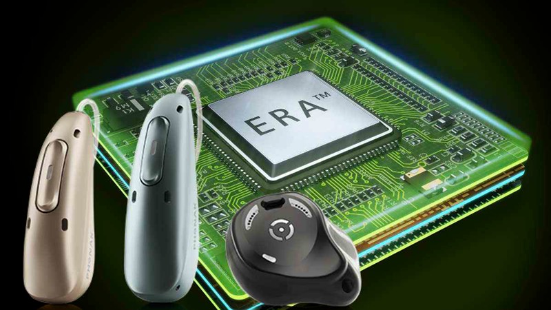 Three hearing aids set against the ERA chip that drives Infinio