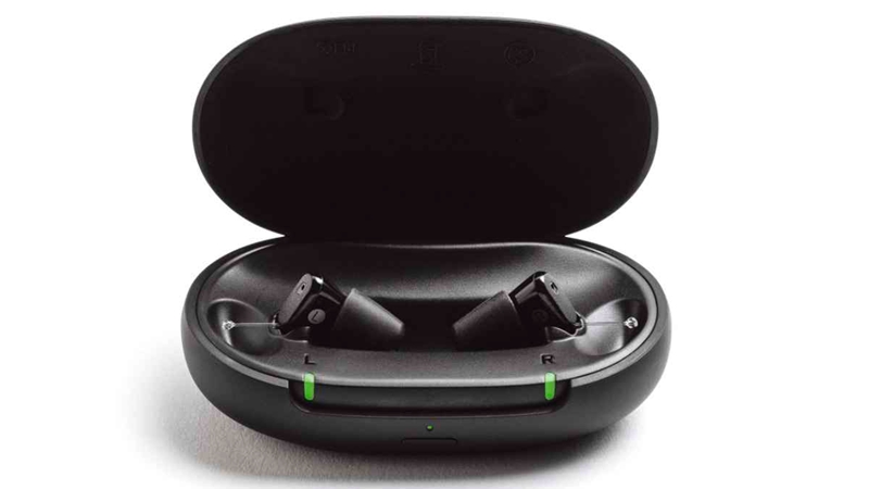 Two black Sony CRE-C20 hearing aids in oval portable charging case