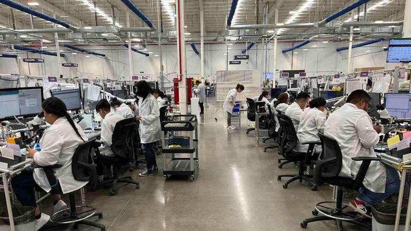 AMDC employees work on the production of Signia hearing aids.