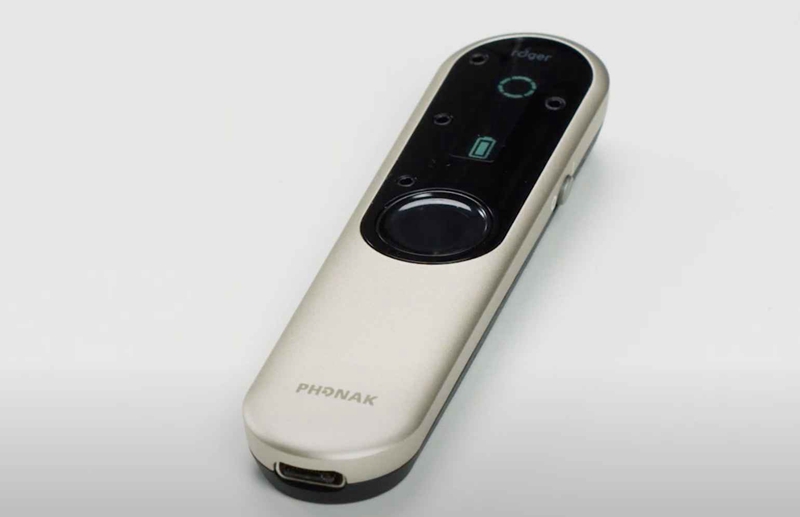 Most major brands of hearing aids and implants include accessories, such as remote microphones and table mics, that facilitate listening in challenging environments, including work settings and meeting rooms. (Shown: Phonak Roger On in Table mode.)