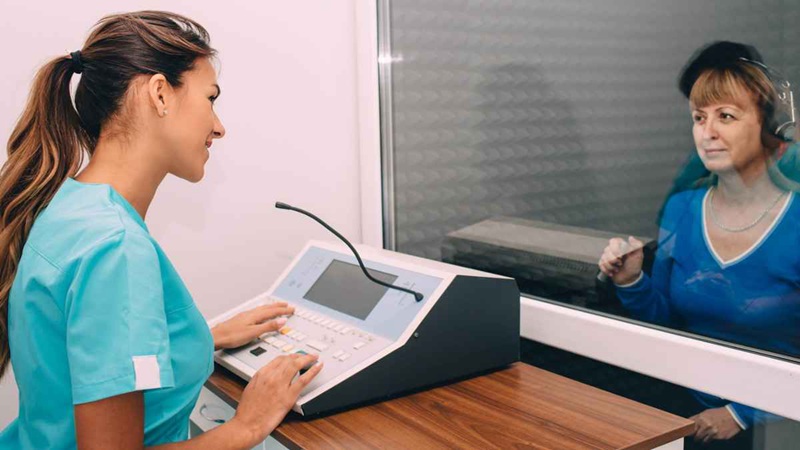 Audiometric testing in a sound booth usually involves some form of, "Please press the button or raise your hand when you hear the tone..." It will also measure your speech understanding, bone-conduction hearing, and other important measures like hearing in noise.