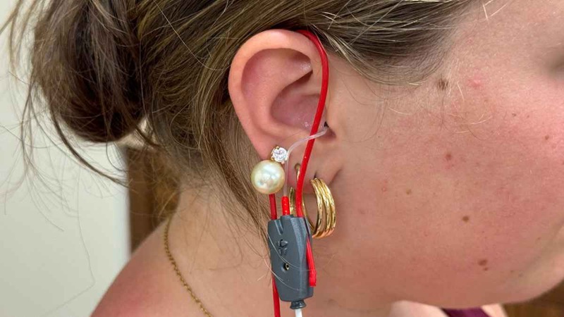 In real-ear measurement (REM), a small probe tube is inserted in your ear with your hearing aid.