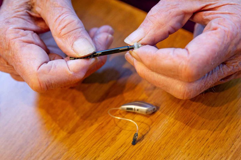 Cleaning hearing aids requires good vision and dexterity.