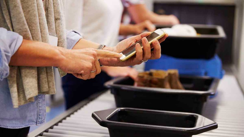 You can wear your hearing aids or implants as you move through security, although it's a good idea to alert the TSA officers so they are aware of the devices. Just to be on the safe side, it's best if you don't put them in the trays and subject them to the X-ray machine.